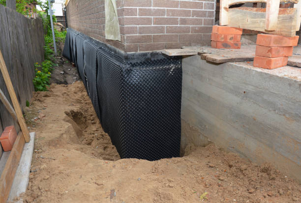 SJ Waterproofing Pros technician performing targeted Vapor Barrier Installation assessment in Geneseo, KS
